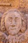 Greece, Crete, Akrotiri. Agia Triada (Holy Trinity) Monastery. Face carved in stone. Art Print